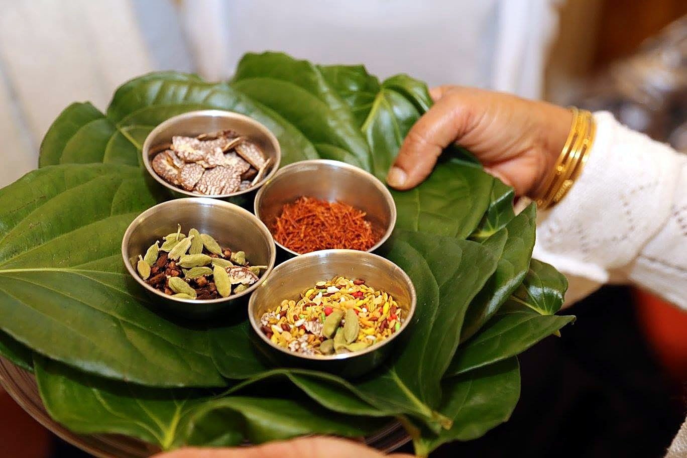 Betel leaves, areca nut and spices offered on a tray at a Vihara ceremony